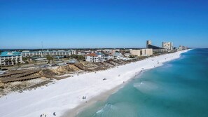 A coastal hotel with a beach view, multiple buildings, and a sandy shoreline. - Amalfi D327 - 3rd Floor Views & Cabana Included! (Miramar Beach)