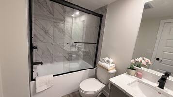 Shower, hair dryer, towels, soap