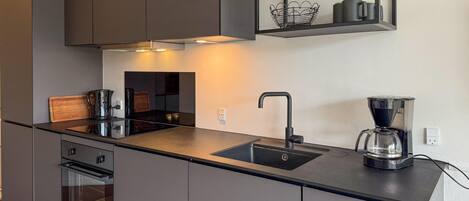 Coffee/tea maker, fridge, stovetop, dishwasher