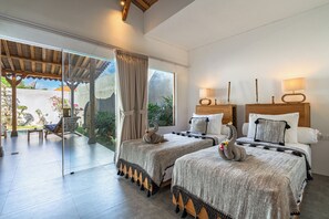 A bedroom with two beds, a glass door leading to an outdoor area, and a wooden ceiling. - Brand New - 2bdrs: Luxury, Concierge & Security (Badung)