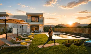 A modern house with a pool, outdoor yoga area, and lounge chairs. - Matis Villa Private Pool (Vathi)