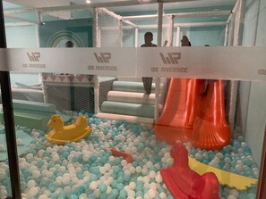 A children's play area with a ball pit, slides, and inflatable toys. - Shamm dream riverside (Nairobi)