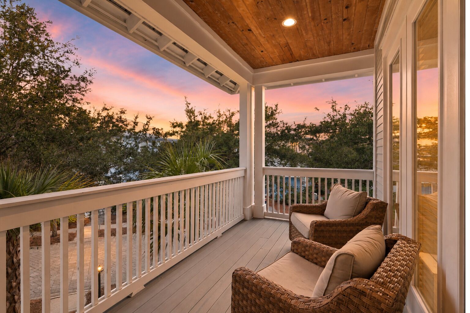 Beautiful twilight view from the covered porch, looking out over the scenic coastal tree canopy.