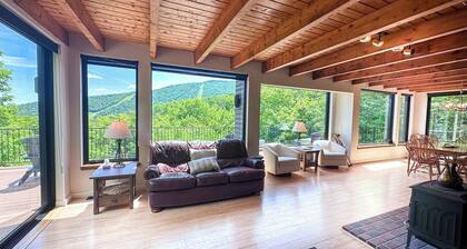 Experience the ultimate Vermont mountain getaway in this spacious 4-bedroom home located right at Sugarbush Resort. Ski-in/ski-out on the mountain, stunning mountain views, and a private sauna, this home is the perfect base for year round escapes.