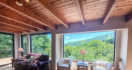 Experience the ultimate Vermont mountain getaway in this spacious 4-bedroom home located right at Sugarbush Resort. Ski-in/ski-out on the mountain, stunning mountain views, and a private sauna, this home is the perfect base for year round escapes.
