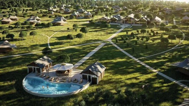 A resort with multiple thatched-roof cottages, a central swimming pool, and a well-maintained lawn. - VICTORIA STARFALL MAASAI MARA (Maasai Mara)