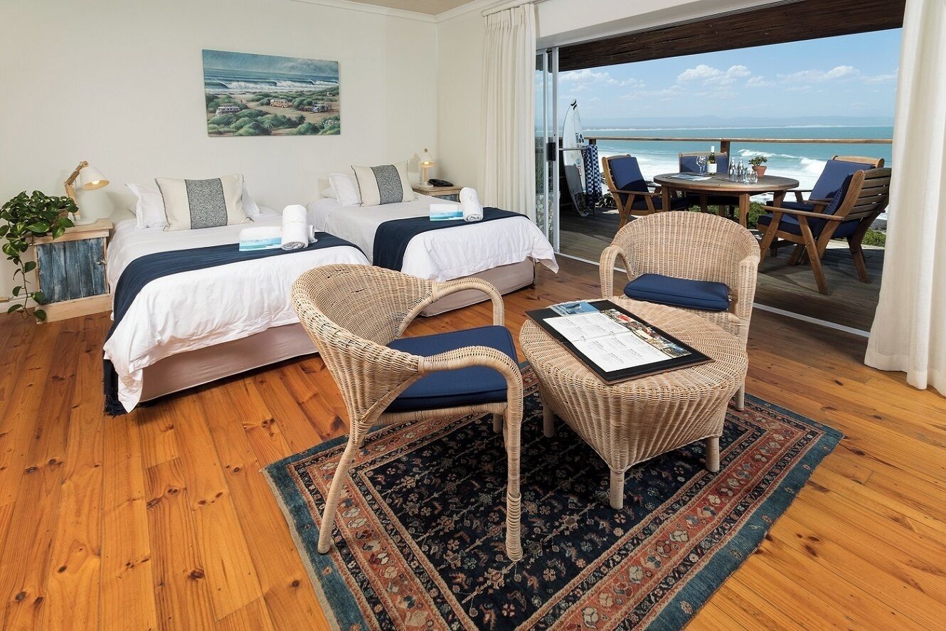 Deluxe Apartment, Beach View | Minibar, in-room safe, laptop workspace, blackout drapes
