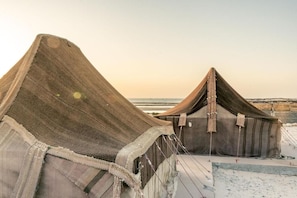 A tent-like structure with a peaked roof, possibly a temporary accommodation or event space. - OCEAN VAGABOND LASSARGA (Dakhla)