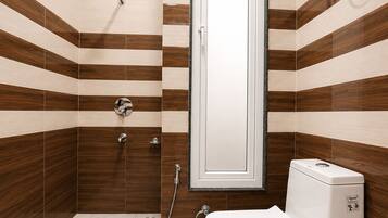 Junior Room | Bathroom | Shower, towels, soap, toilet paper