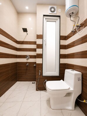 Junior Room | Bathroom | Shower, towels, soap, toilet paper - Hotel Blue Fern (Greater Noida)