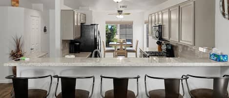 Coffee/tea maker, fridge, microwave, oven