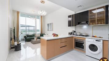 Deluxe Apartment, Balcony, City View | Private kitchen | Electric kettle, toaster, highchair, freezer
