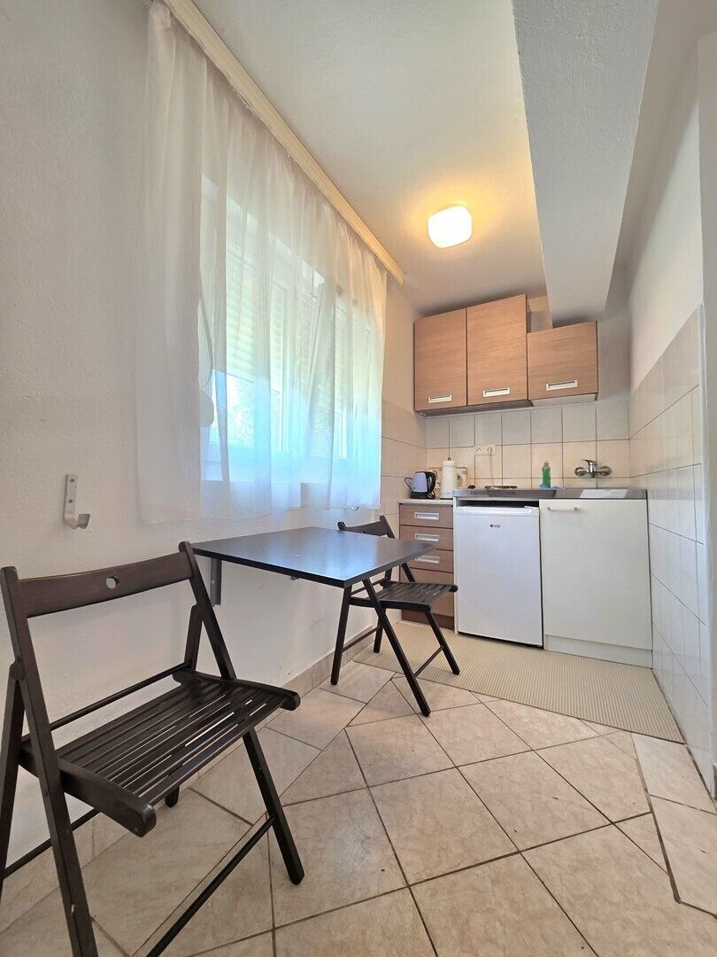 Fridge, coffee/tea maker, cookware/dishes/utensils