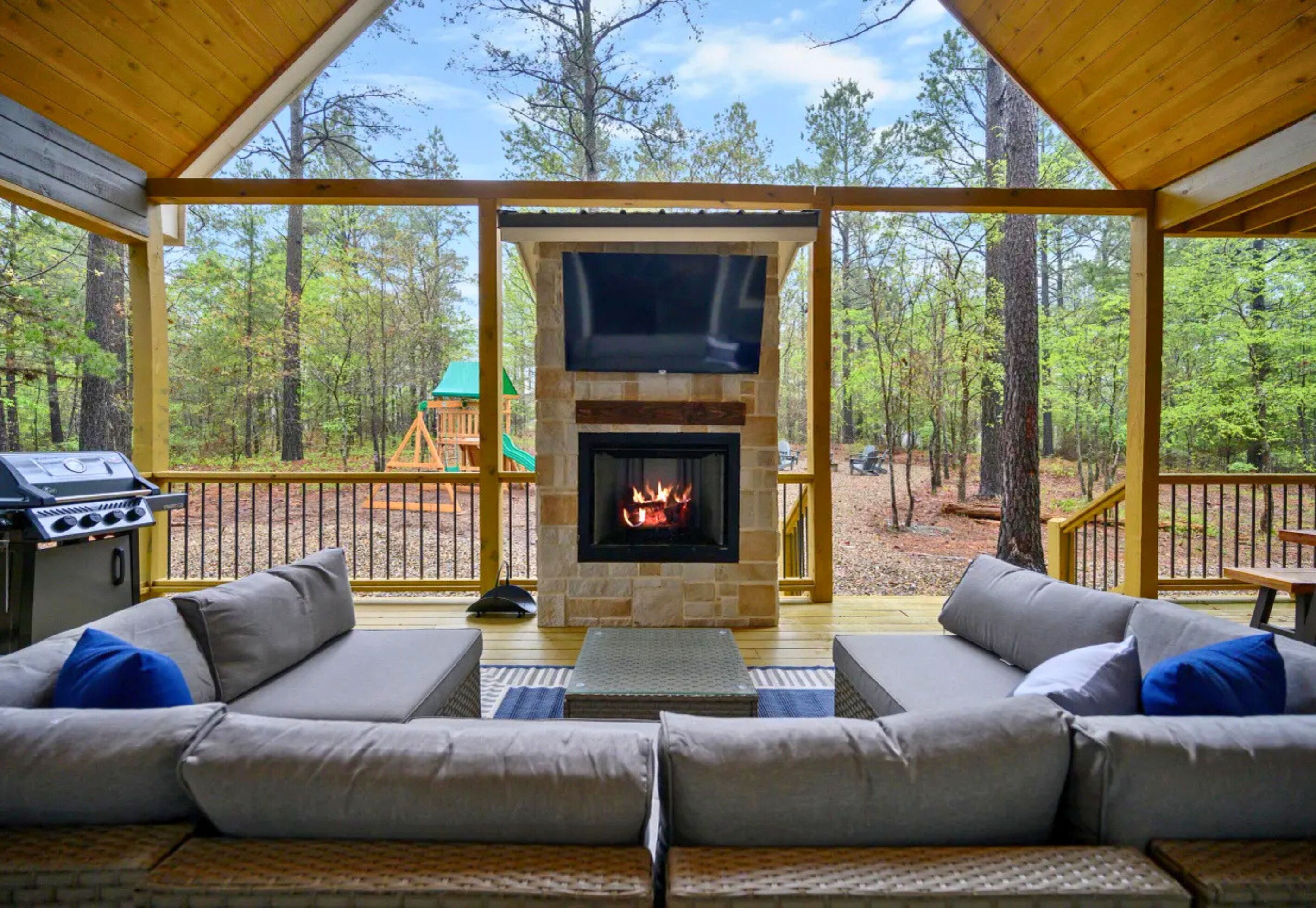 Gather around the outdoor fireplace as the sun sets and enjoy one of the cabin's most popular spaces for relaxing together.