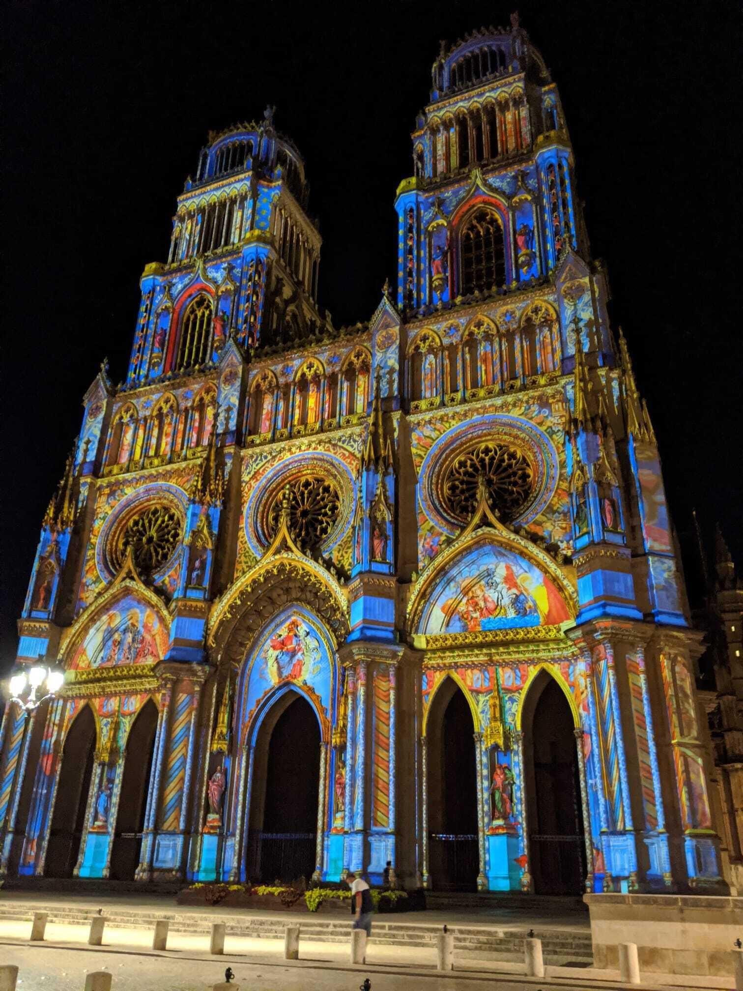 A large, ornate cathedral with twin towers and intricate stained glass windows.