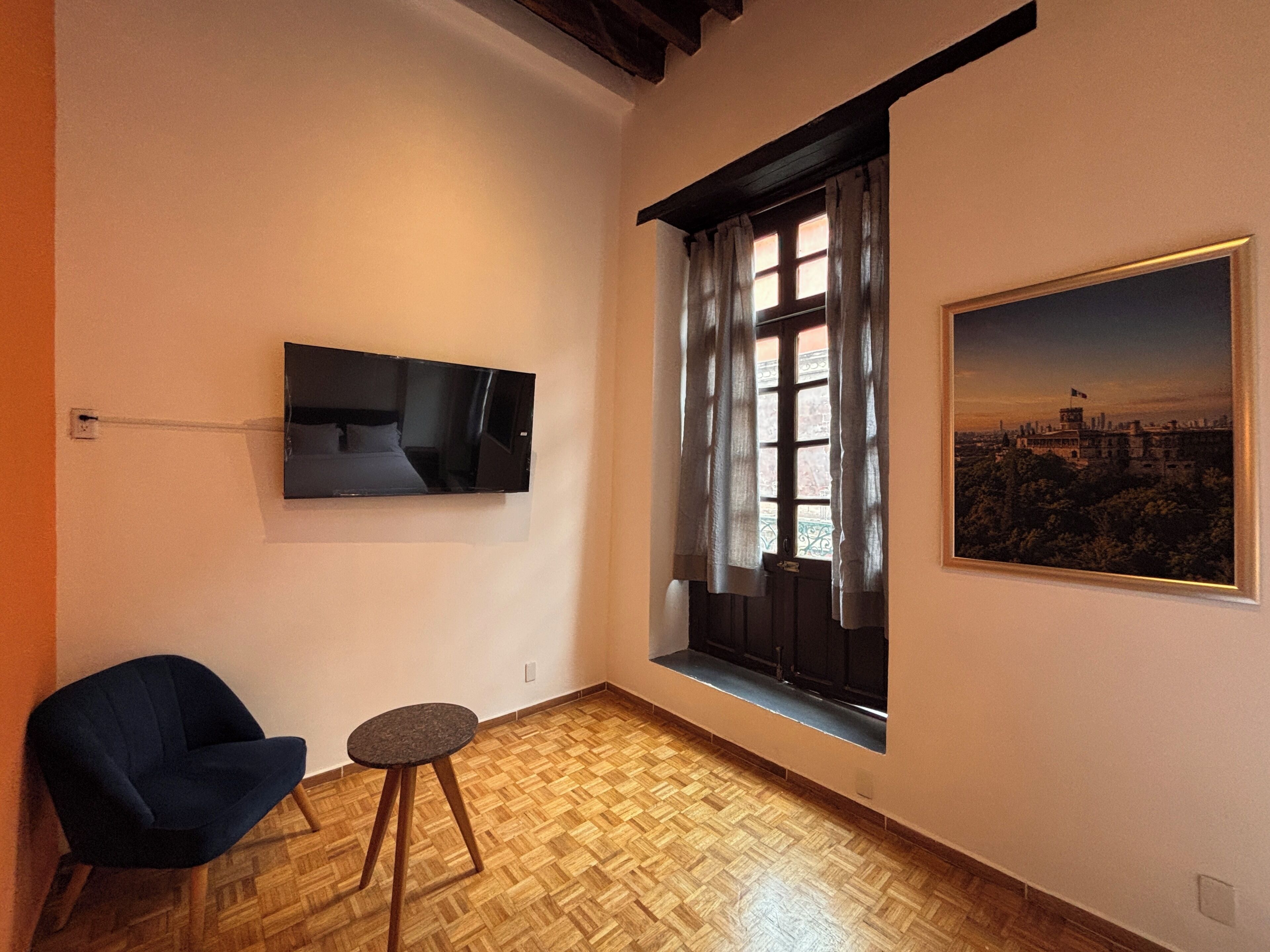 Classic Quadruple Room, Balcony, City View | Living area