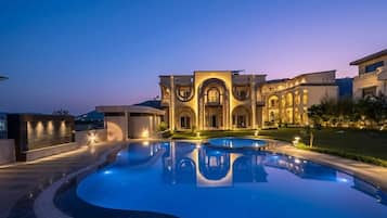 2 outdoor pools, open 8:00 AM to 8:00 PM, pool umbrellas, pool loungers