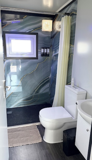 Shower, hair dryer, towels, soap