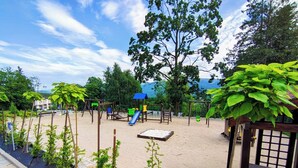 A playground with swings, slides, and climbing structures.