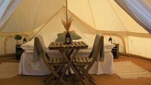 A tent with a table and chairs set up inside. - 4 Person Holiday Home in Sejero (Sejero)