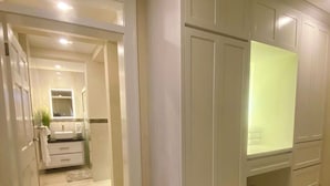 A modern kitchen with white cabinetry, a built-in oven, and a countertop. - Jaden's Guest House - by Zenbreak (Cane Garden)
