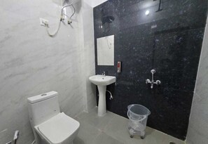 A bathroom with a toilet, sink, and shower. - Townhouse IIM Lucknow Formerly Lexa Grand (Lucknow)