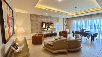 Executive Penthouse, City View | Living area | 65-inch Smart TV with satellite channels, Netflix, streaming services