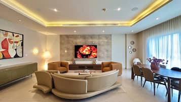 Executive Penthouse, City View | Living area | 65-inch Smart TV with satellite channels, Netflix, streaming services