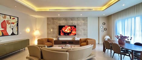 Executive Penthouse, City View | Living area | 65-inch Smart TV with satellite channels, Netflix, streaming services