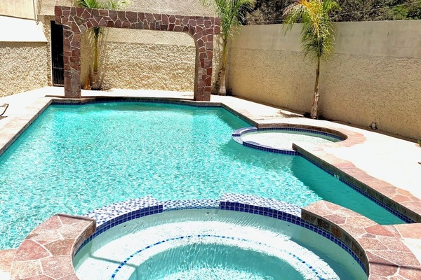 Seasonal outdoor pool, open 10:00 AM to 9:30 PM, pool umbrellas