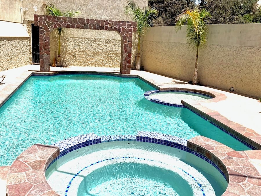 Seasonal outdoor pool, open 10:00 AM to 9:30 PM, pool umbrellas