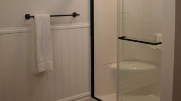 Shower, towels, soap, toilet paper