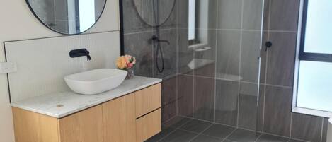 Shower, hair dryer, towels, soap