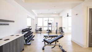 A modern gym with weight racks, benches, and cardio equipment. - Landing | Incredible 2BD, Gym, Clubhouse (Mountain Brook)