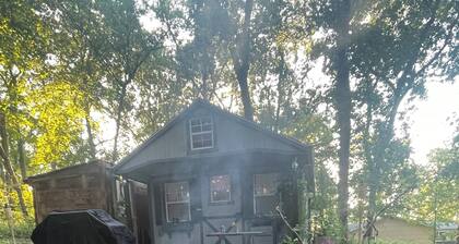 Enjoy nature in this 1-bedroom cabin with AC/Heat in rural Knoxville, Iowa.