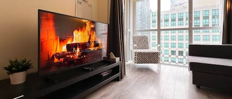 Deluxe Apartment, Multiple Beds, Non Smoking, Private Bathroom | Living area | 50-inch TV with digital channels