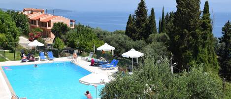 Basic Studio, Balcony, Sea View | Pool | Seasonal outdoor pool, open 9:00 AM to 8:00 PM, pool umbrellas