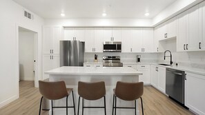 Fridge, dining tables - Landing | Amazing 2BD, Pool, Clubhouse (North Las Vegas)