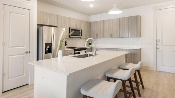 Fridge, dining tables - Landing | Amazing 2BD, Gym, Rooftop Lounge (Frisco)