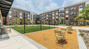 Outdoor dining - Landing | Chic 1BD, Rooftop Lounge, Gym (Frisco)