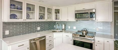 Coffee/tea maker, fridge, microwave, oven