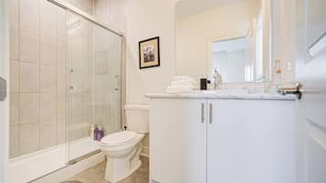 Hair dryer, towels, shampoo, toilet paper