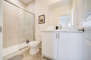 Hair dryer, towels, shampoo, toilet paper