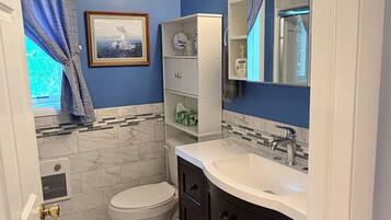 Shower, towels, soap, toilet paper