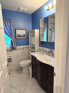 Shower, towels, soap, toilet paper