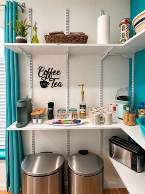 A kitchen with a coffee and tea sign, a coffee machine, a toaster, and stainless steel trash bins. - ABQ Getaway Kings, 3 Bdrm, 2.5 Bath, Patio Large Yard, Primary Suite & Game Loft (Albuquerque)