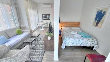 Deluxe Quadruple Room, City View | Desk, blackout curtains, iron/ironing board, free WiFi
