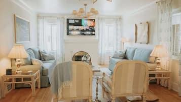 Smart TV, fireplace, books, offices
