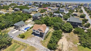 A residential area with houses, a swimming pool, and a view of the ocean. - SO488 Salvo Sunrise -  Newly renovated oceanside home (Salvo)