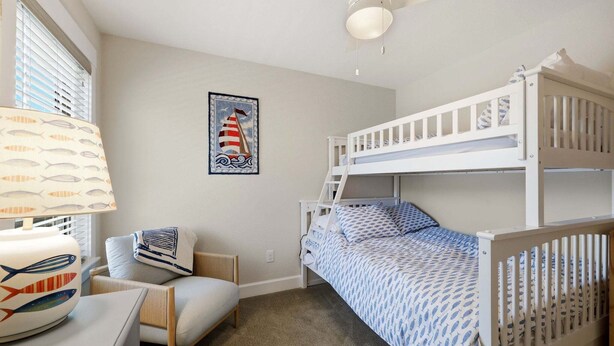 A bunk bed room with a desk and chair, a lamp, and a framed picture on the wall. - SO488 Salvo Sunrise -  Newly renovated oceanside home (Salvo)